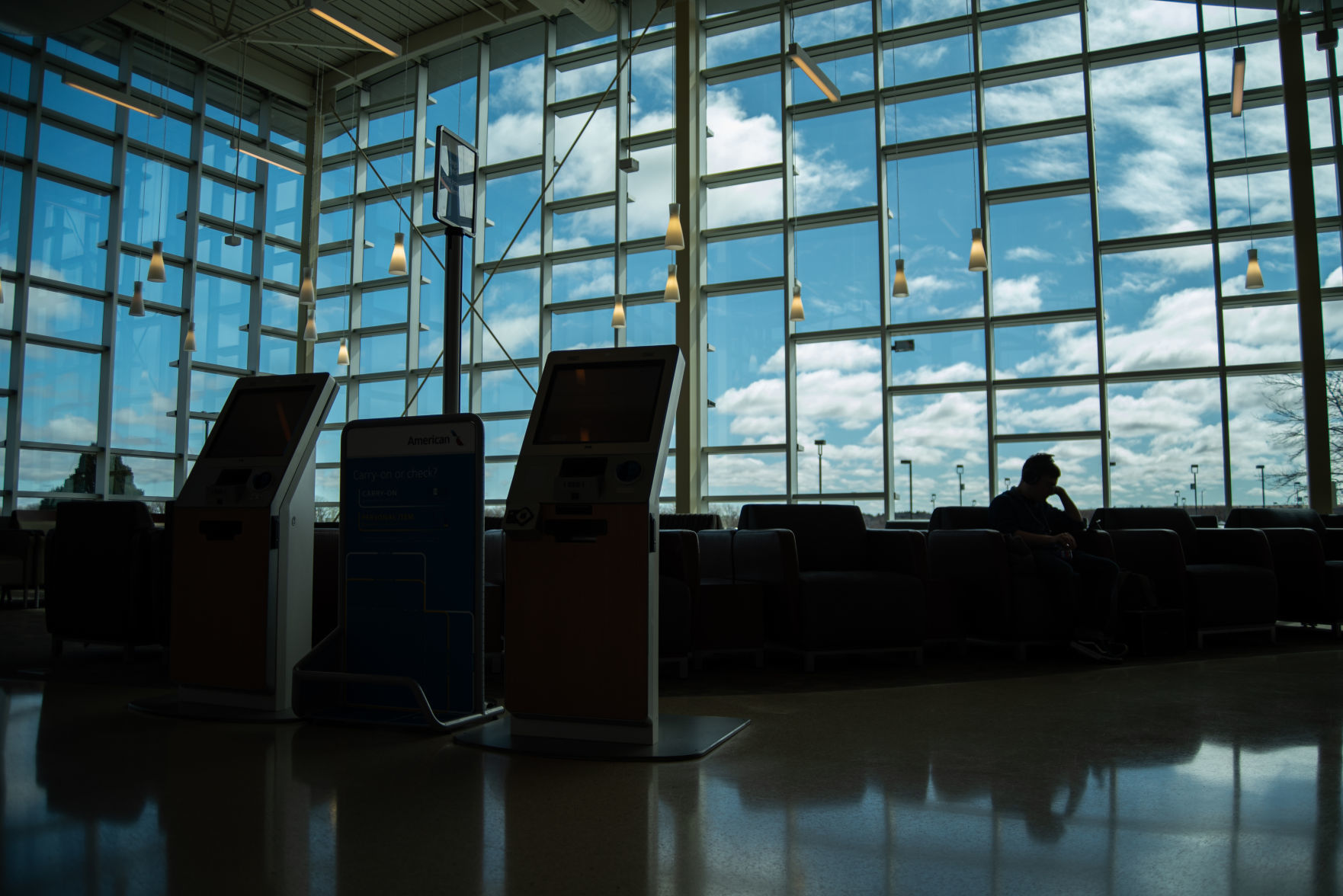 Anthony Allen sits alone in the Manhattan Regional Airport on Wednesday. Allen stated that he is heading home to Tennessee to be with family.
